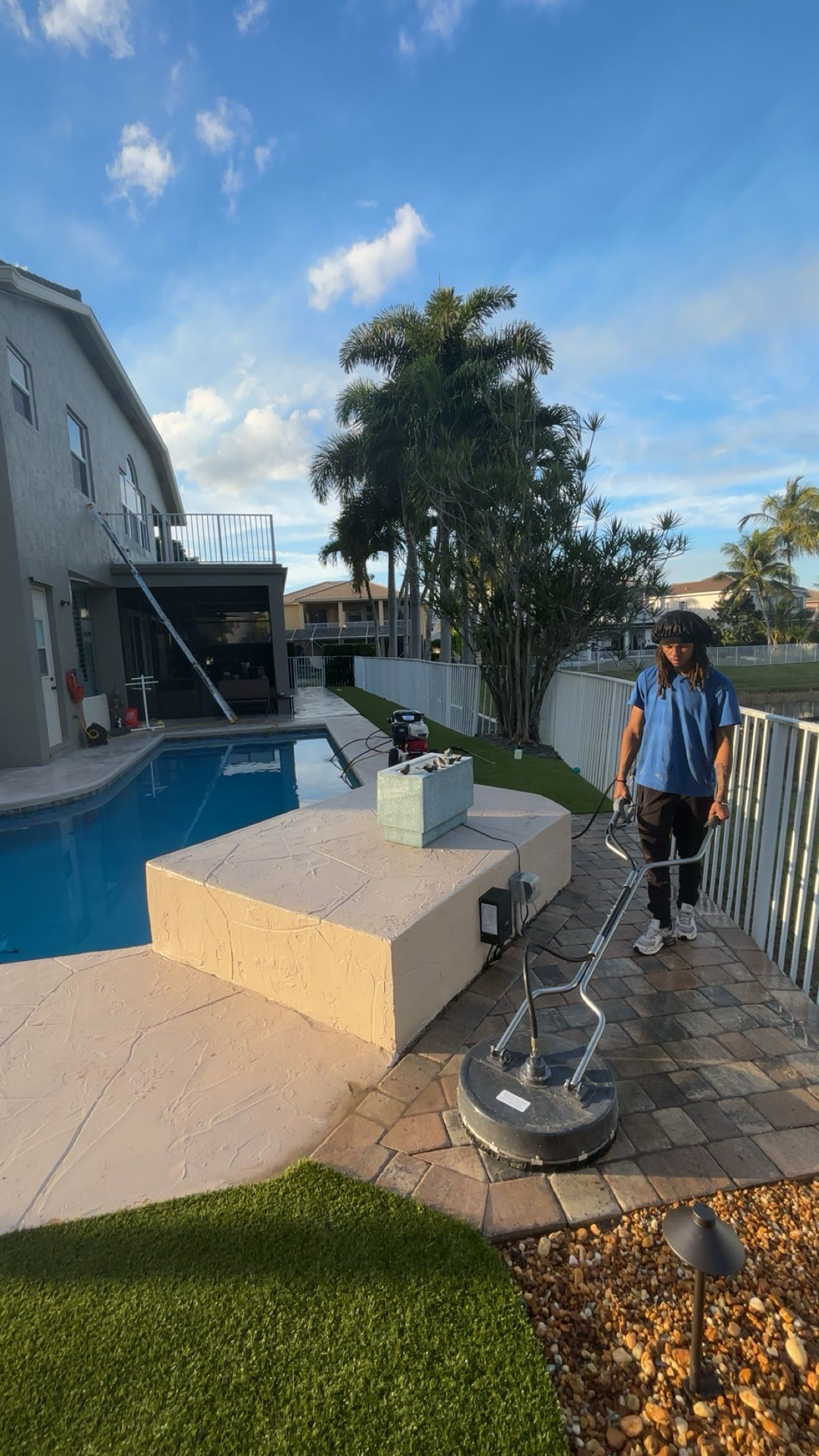 Bright Sight Pro technician surface cleaning pavers poolside